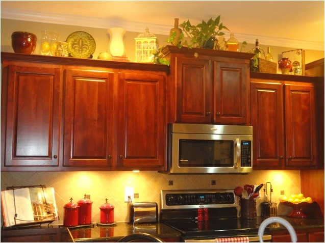 decorating above kitchen cabinets tuscan style