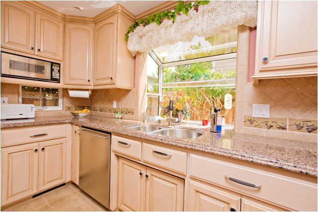 wine themed kitchen with wine cooler and grape tile details traditional kitchen san francisco