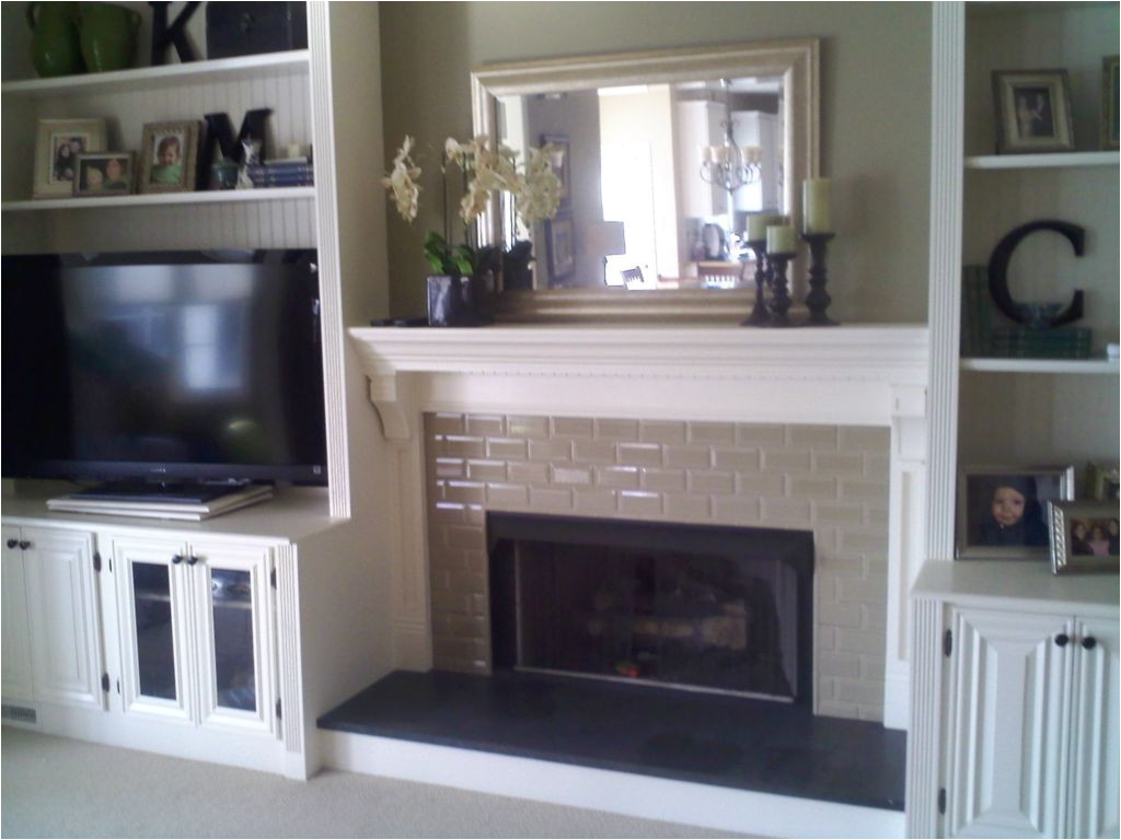 fireplace with built in bookshelves custom trimwork and painting fireplace mantels built in cabinets