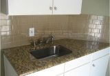 New Venetian Gold Granite Subway Tile Backsplash Example Of New Venetian Gold Granite In White Kitchen with